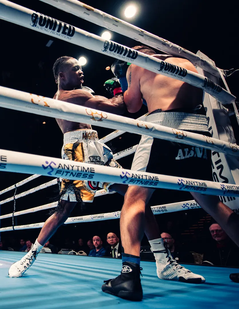 Thomas working an opponent into the ropes