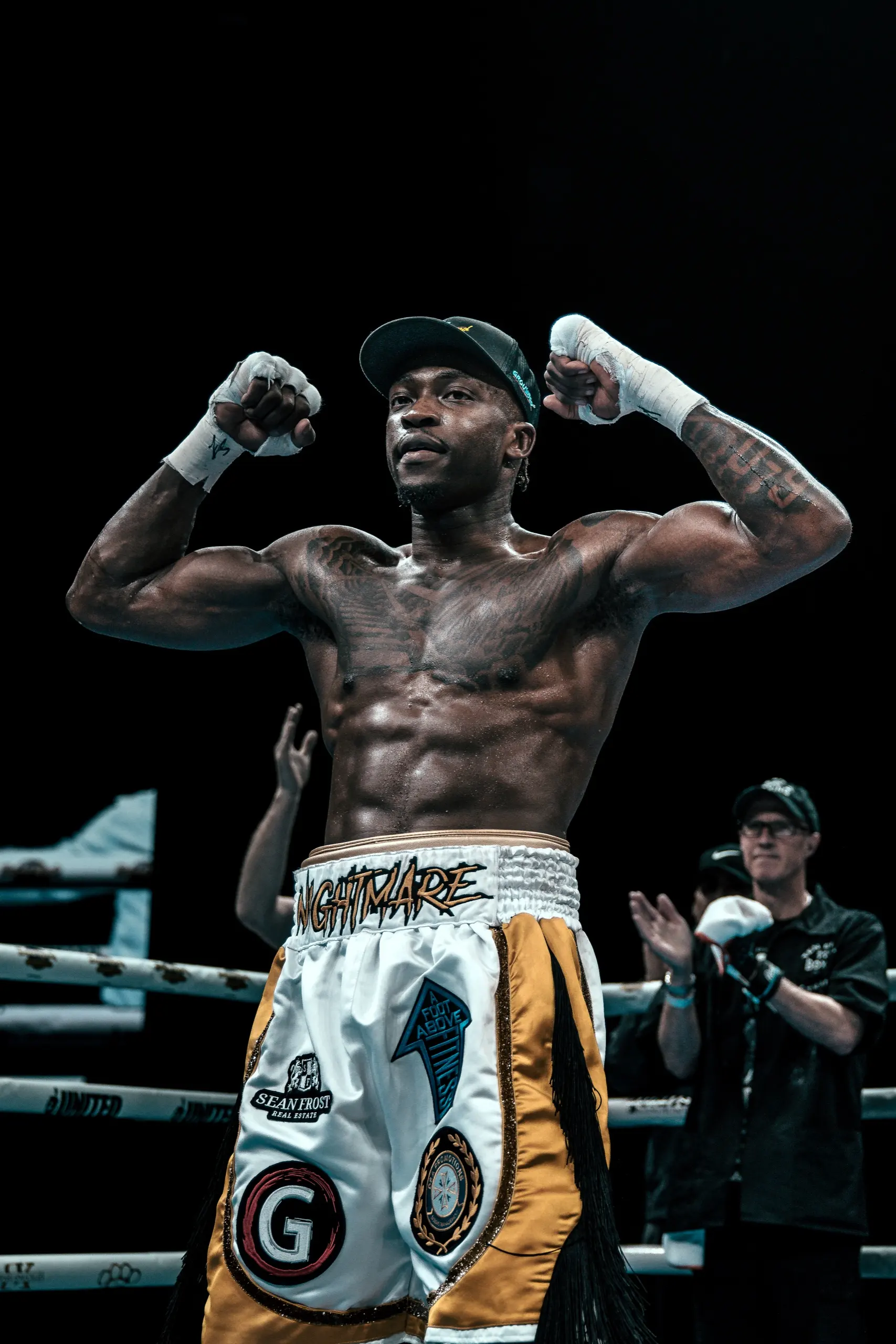 Thomas flexing both arms after the decision