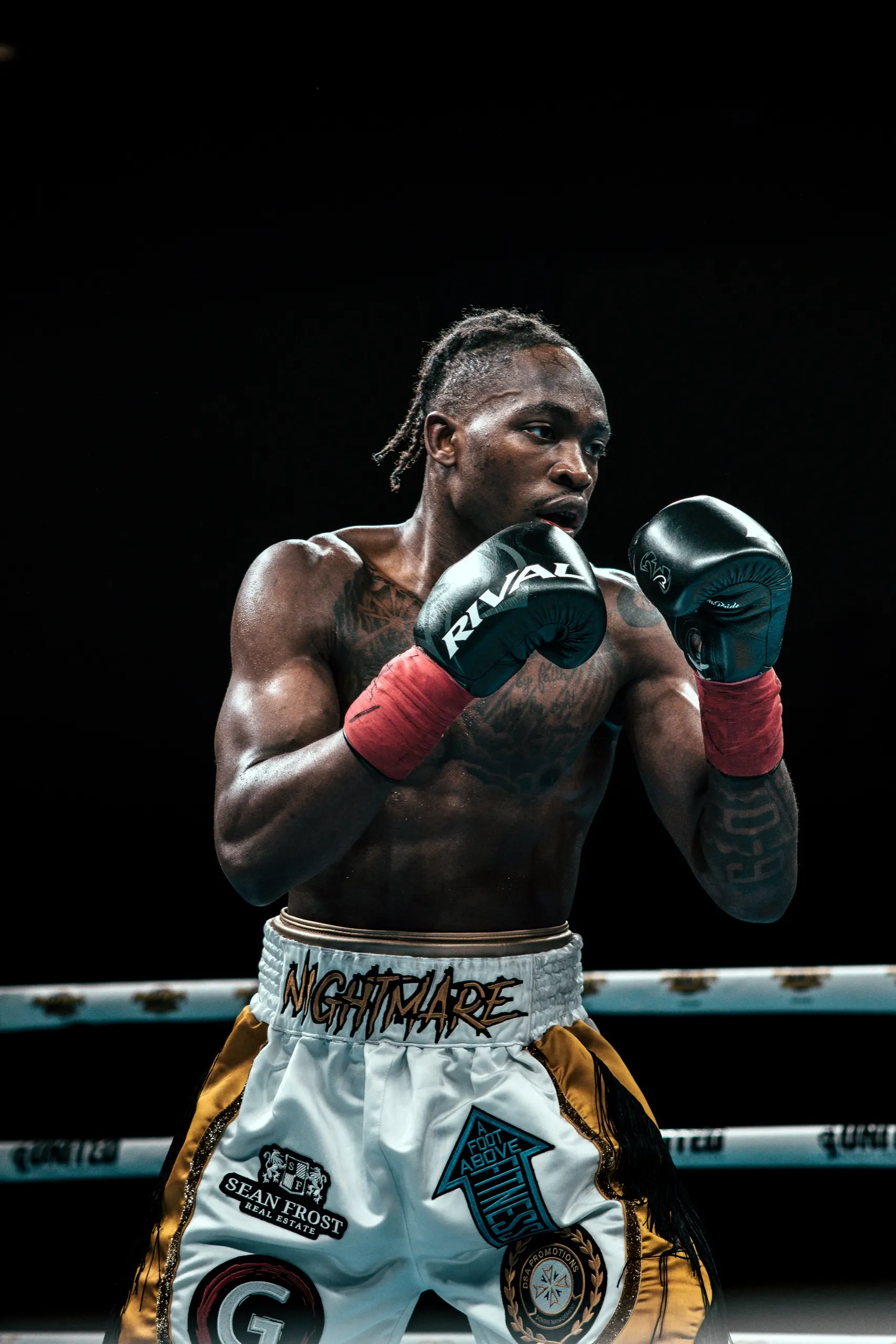 Mccainly Thomas in a high guard inside the ring