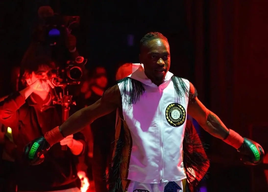Thomas walking out to the ring under red light